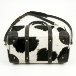 Black cowhide pony hair leather duffel bag luxury travel bottom Side view